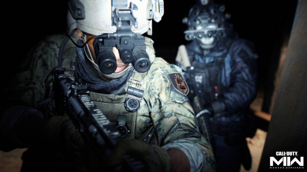 two soldiers from MW2 wearing night vision goggles walking down a dark corridor