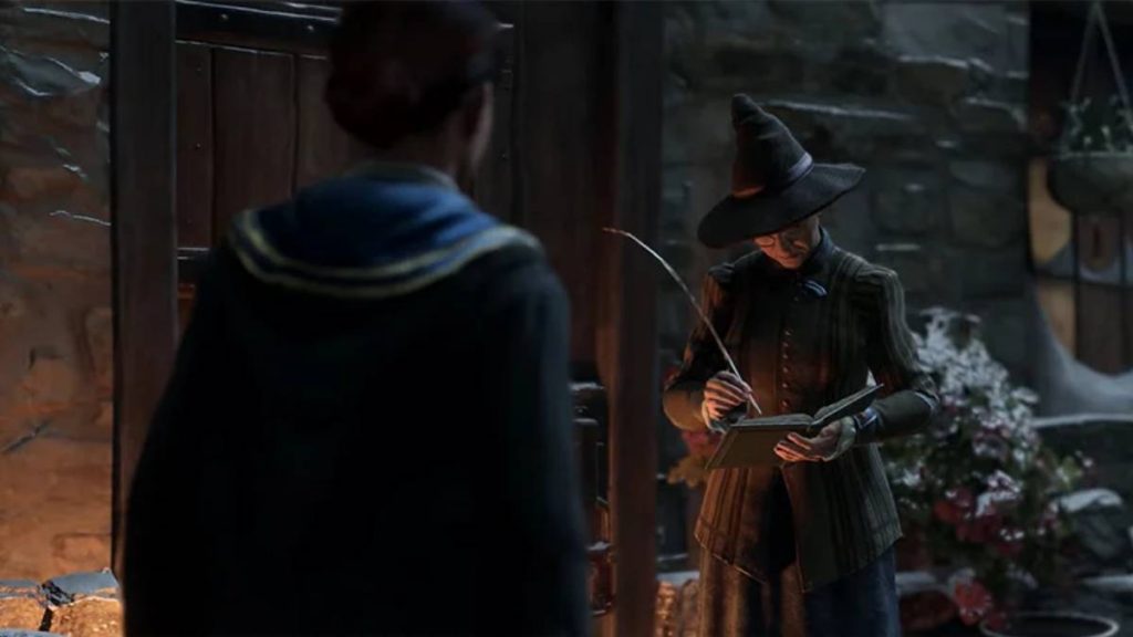 the player character from Hogwarts Legacy standing near a shop in Hogsmeade while Cassandra Mason writes in a book opposite