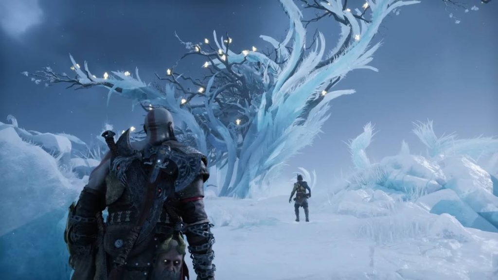 Kratos and Atreus walking through the snow towards a tree made of ice in God of War Ragnarok
