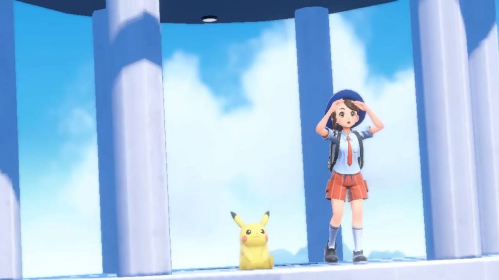 the player and Pikachu on top of a tower in Pokemon Scarlet & Violet