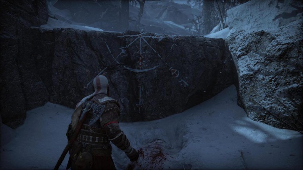Kratos stood next to a tall ledge