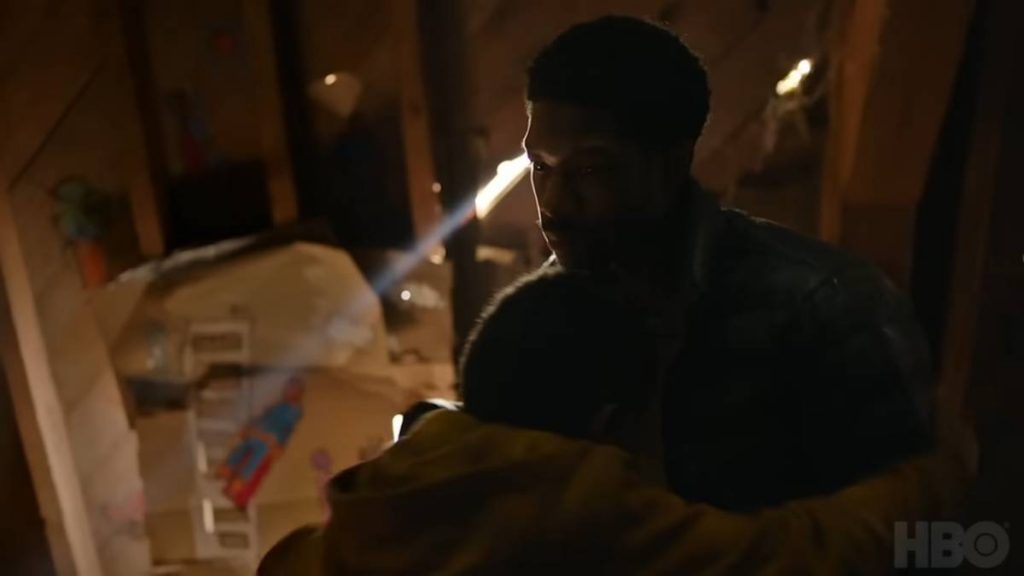 Lamar Johnson as Henry hugging Sam in The Last of Us TV show