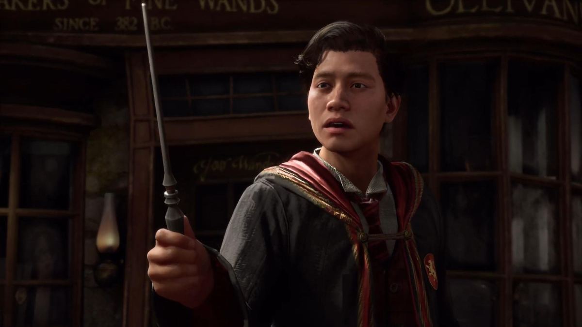 the player character holding a wand in Hogwarts Legacy