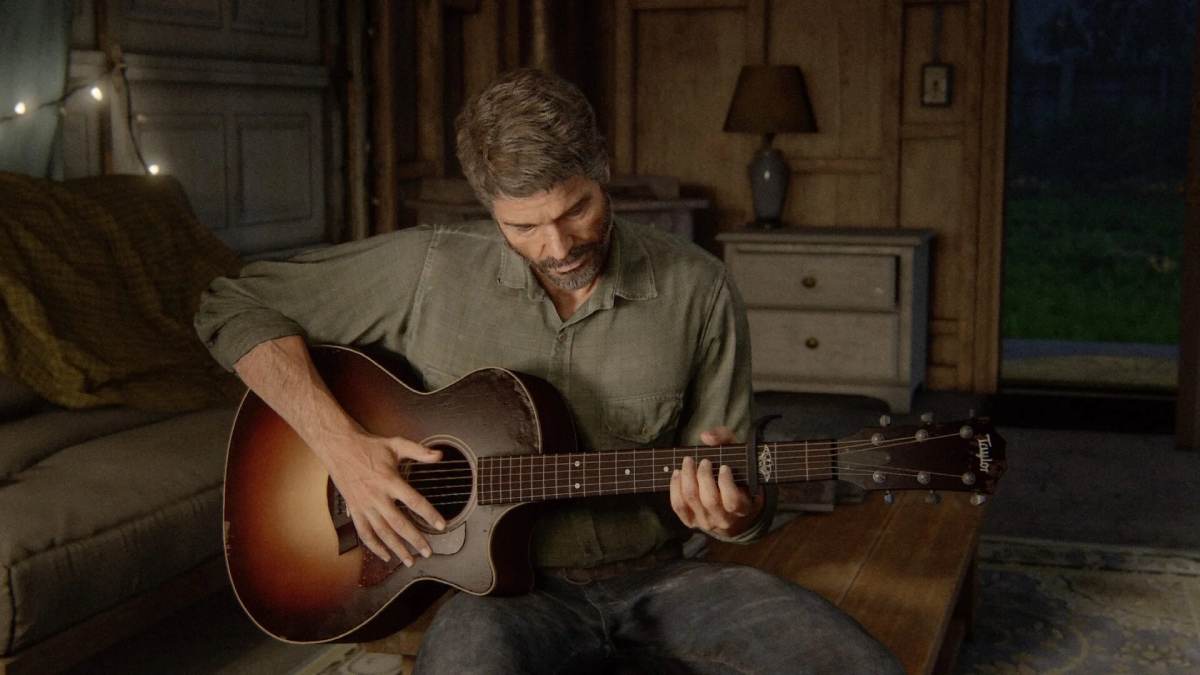 Joel playing the guitar in The Last of Us Part 1