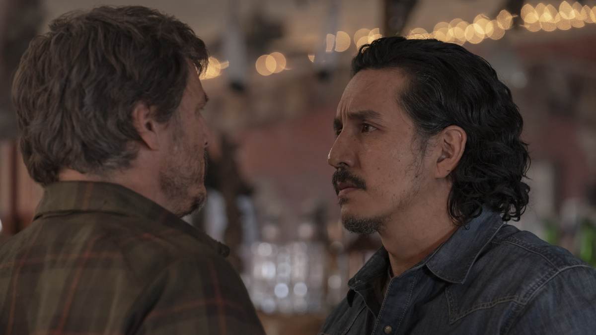 Joel and Tommy looking at one another in the bar in Jackson in The Last of Us TV show episode 6