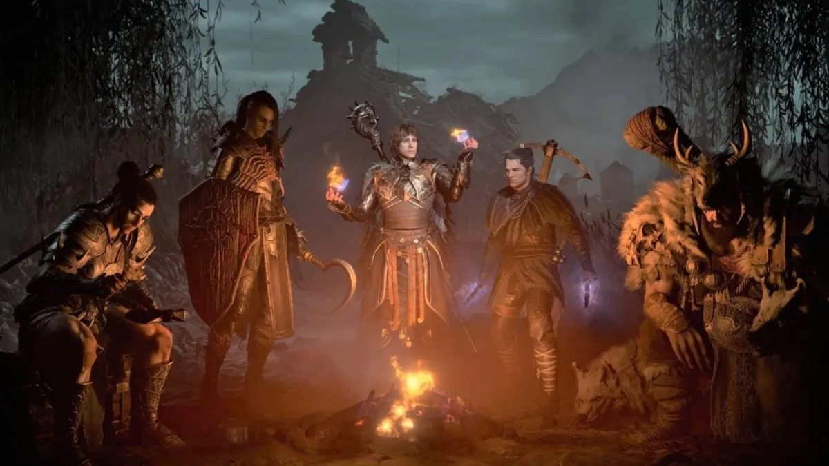 Diablo 4's Druid, Necromancer, Sorcerer, Rogue and Barbarian huddled around a campfire