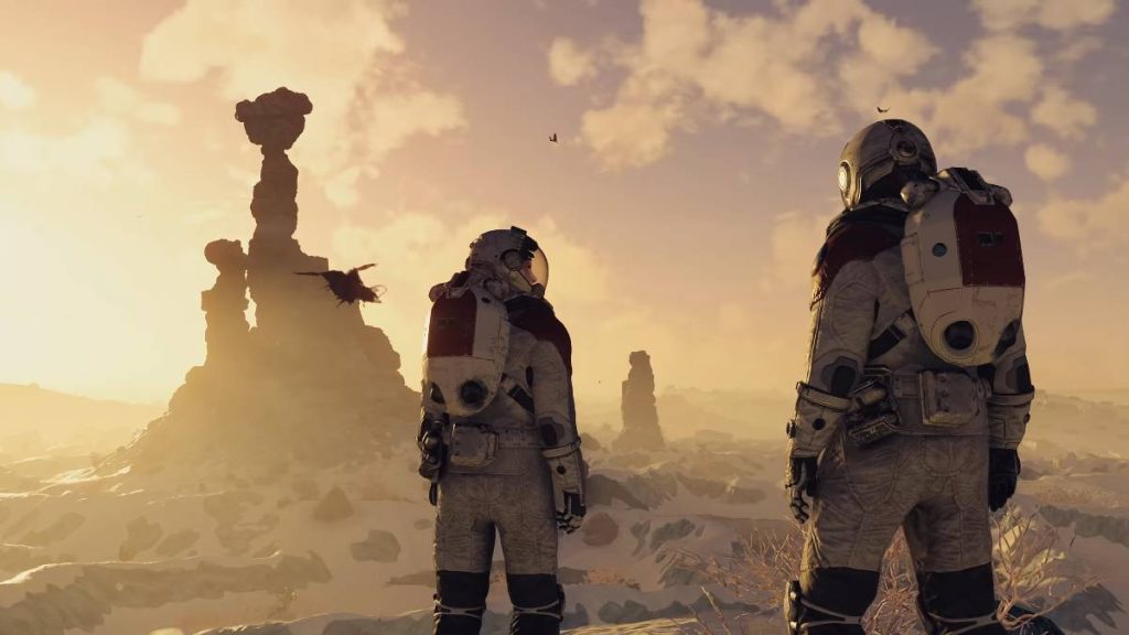 The player and their companion in space suits walking across a planet in Starfield
